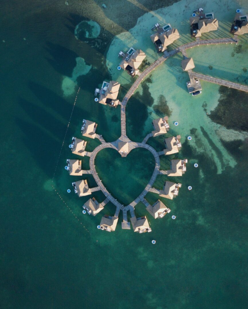 A heart shaped pool surrounded by water.